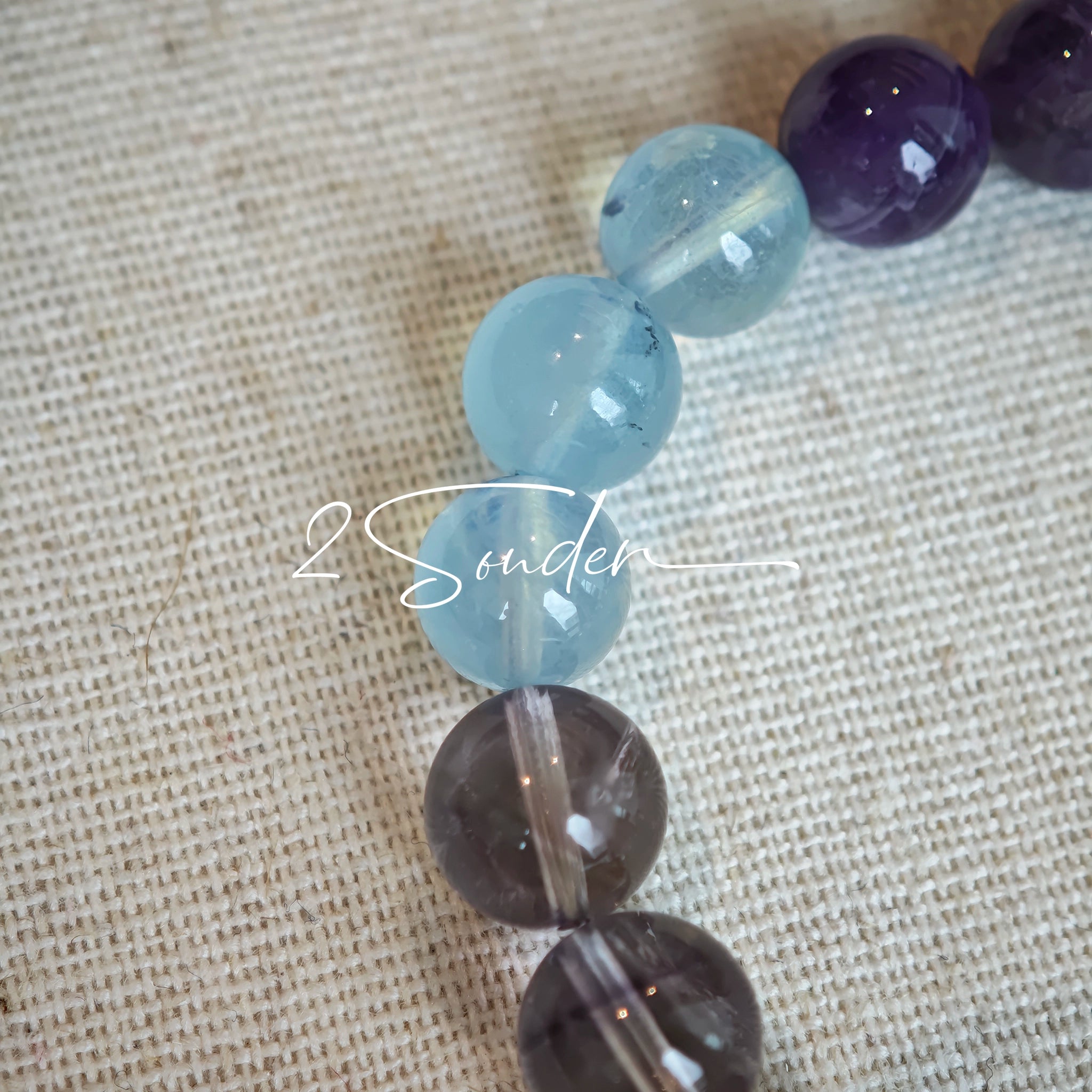 This is a gemstone bracelet consists of different gemstones. They are blue aquamarines, purple amethysts, yellow citrines and transparent clear quartz. It's with 16cm circumference.