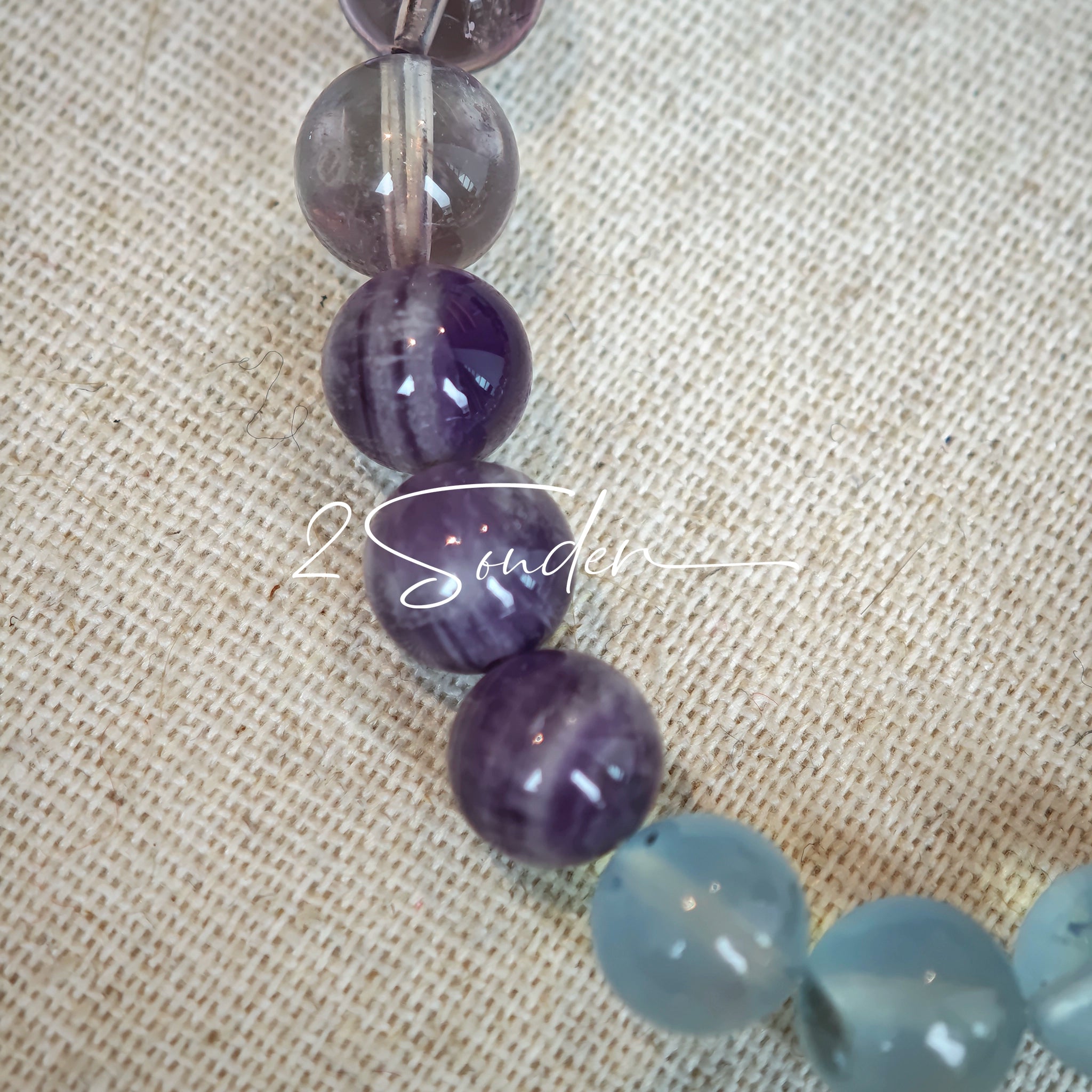 This is a gemstone bracelet consists of different gemstones. They are blue aquamarines, purple amethysts, yellow citrines and transparent clear quartz. It's with 16cm circumference.