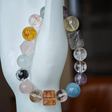 This multi gemstone bracelet features aquamarine, amethyst, strawberry quartz, rose quartz, green phantom quartz, and black rutilated quartz.