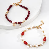 This is a bracelet consist of genuine 925 silver, luminous 5-6mm freshwater pearls, and striking cinnabar. The bracelet measures 16cm with a 3cm extender.