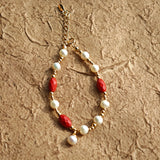 This is a bracelet consist of genuine 925 silver, luminous 5-6mm freshwater pearls, and striking cinnabar. The bracelet measures 16cm with a 3cm extender.