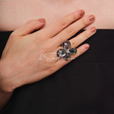 Each piece in this ring and earring set is meticulously crafted from natural mother-of-pearl, showcasing its naturally radiant luster. The large floral design is the main feature of the ring, with rich, vintage-inspired colors and unique natural textures, making each piece one-of-a-kind.