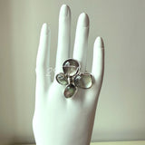 Each piece in this ring and earring set is meticulously crafted from natural mother-of-pearl, showcasing its naturally radiant luster. The large floral design is the main feature of the ring, with rich, vintage-inspired colors and unique natural textures, making each piece one-of-a-kind.