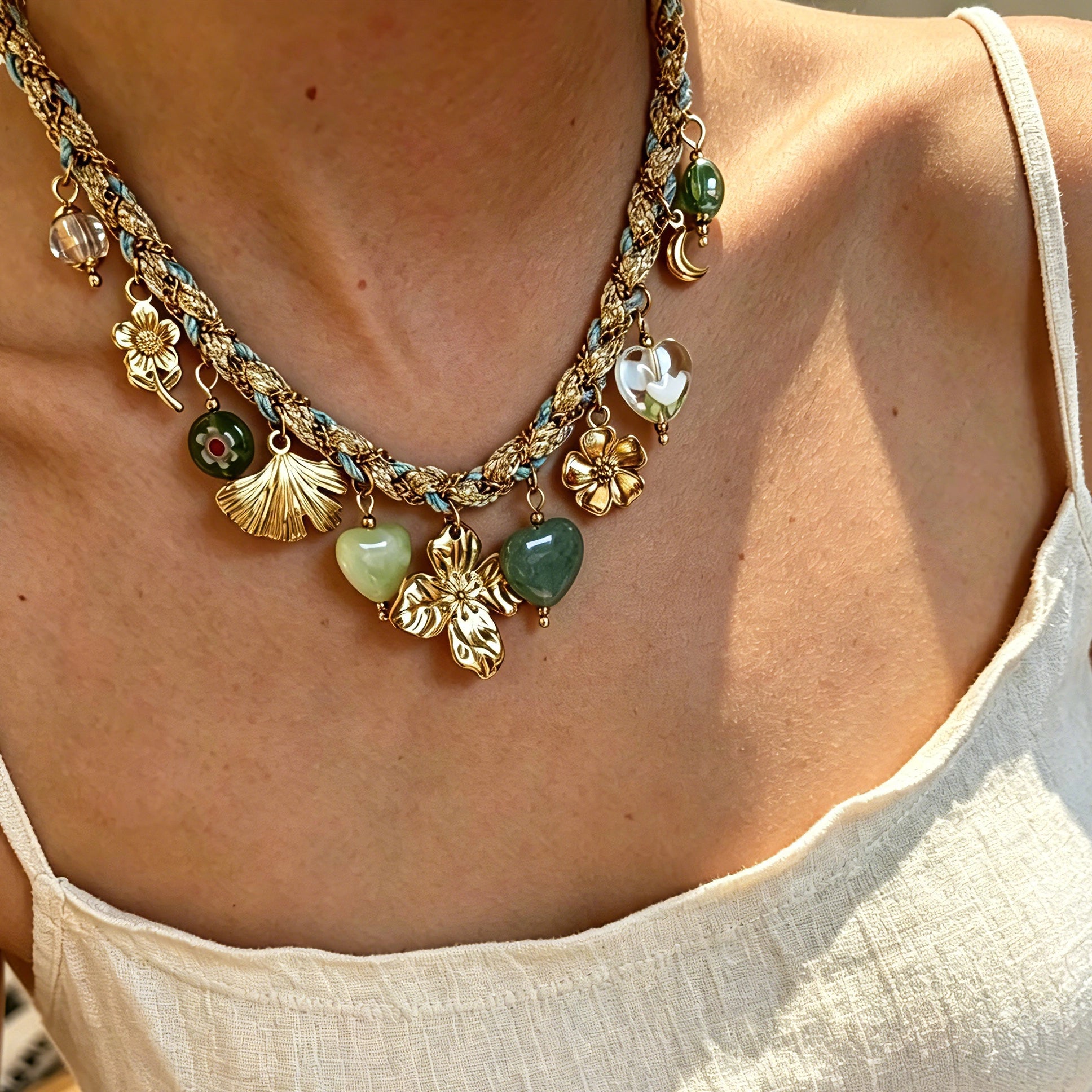 This charming jewelry set includes a braided cord necklace and matching bracelet adorned with glossy resin heart charms, polished stainless steel floral pendants and assorted decorative beads. Soft turquoise woven threads blend beautifully with golden metal accents, bringing a fresh, romantic pastoral vibe. Perfect for spring outings, picnic photoshoots, afternoon dates and visits to art markets. It also pairs wonderfully with camisoles and linen outfits for daily commuting, adding gentle natural flair to a