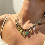 This charming jewelry set includes a braided cord necklace and matching bracelet adorned with glossy resin heart charms, polished stainless steel floral pendants and assorted decorative beads. Soft turquoise woven threads blend beautifully with golden metal accents, bringing a fresh, romantic pastoral vibe. Perfect for spring outings, picnic photoshoots, afternoon dates and visits to art markets. It also pairs wonderfully with camisoles and linen outfits for daily commuting, adding gentle natural flair to a