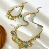 This charming jewelry set includes a braided cord necklace and matching bracelet adorned with glossy resin heart charms, polished stainless steel floral pendants and assorted decorative beads. Soft turquoise woven threads blend beautifully with golden metal accents, bringing a fresh, romantic pastoral vibe. Perfect for spring outings, picnic photoshoots, afternoon dates and visits to art markets. It also pairs wonderfully with camisoles and linen outfits for daily commuting, adding gentle natural flair to a