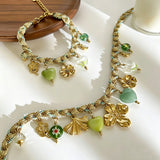 This charming jewelry set includes a braided cord necklace and matching bracelet adorned with glossy resin heart charms, polished stainless steel floral pendants and assorted decorative beads. Soft turquoise woven threads blend beautifully with golden metal accents, bringing a fresh, romantic pastoral vibe. Perfect for spring outings, picnic photoshoots, afternoon dates and visits to art markets. It also pairs wonderfully with camisoles and linen outfits for daily commuting, adding gentle natural flair to a