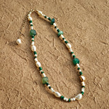 This is a necklace consist of 925 sterling silver with a vintage gold finish, featuring real pearls, malachite, and green agate. The chain is 36cm with a 7cm extender, ensuring it lays beautifully.
