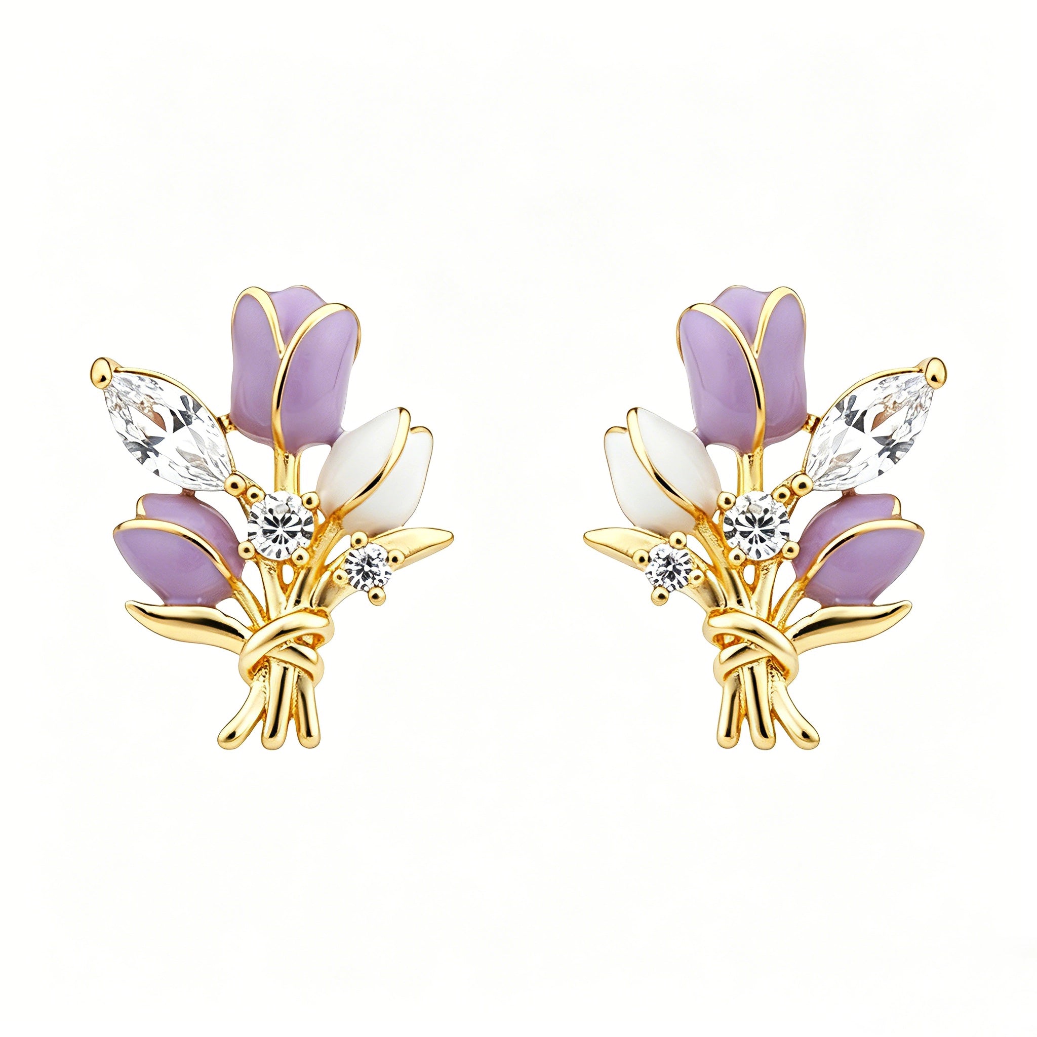 These stud earrings feature an elegant bouquet design, crafted with a thick 18K real gold plating. The arrangement showcases delicate purple and white enamel tulip flowers, accented with sparkling marquise and round-cut cubic zirconia stones, all set in a polished gold-tone metal structure tied with a decorative knot at the base. The overall style is romantic and refined, perfect for adding a touch of floral charm to any look.