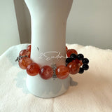 This is a original gemstone bracelet consists of Red Hematoid Quartz. In the bracelet, there is a Black Onyx loop. The bracelet is in red color, which looks very warm and vibrant.