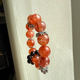 This is a original gemstone bracelet consists of Red Hematoid Quartz. In the bracelet, there is a Black Onyx loop. The bracelet is in red color, which looks very warm and vibrant.
