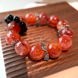 This is a original gemstone bracelet consists of Red Hematoid Quartz. In the bracelet, there is a Black Onyx loop. The bracelet is in red color, which looks very warm and vibrant.