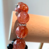 This is a original gemstone bracelet consists of Red Hematoid Quartz. In the bracelet, there is a Black Onyx loop. The bracelet is in red color, which looks very warm and vibrant.
