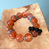 This is a original gemstone bracelet consists of Red Hematoid Quartz. In the bracelet, there is a Black Onyx loop. The bracelet is in red color, which looks very warm and vibrant.
