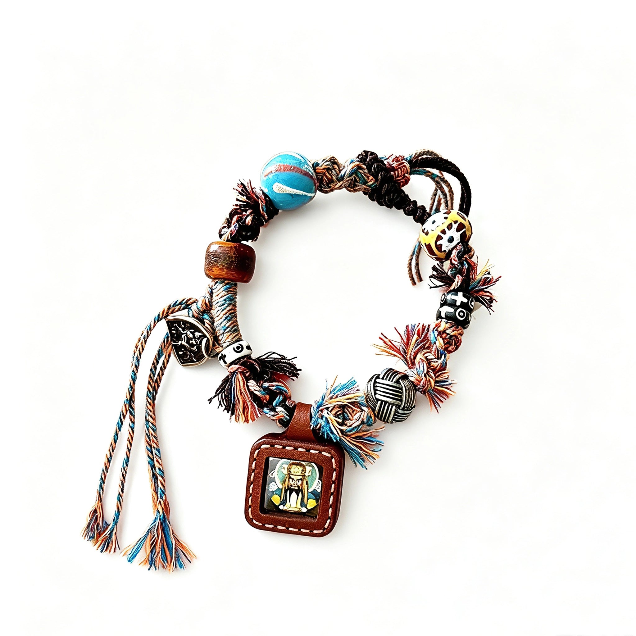 This vintage hand-woven bracelet features vibrant mixed-color tassels and diverse decorative beads. It comes with a small leather thangka pendant, blending ethnic charm with playful dopamine styling. Each braided detail is handcrafted for a unique, bohemian look.