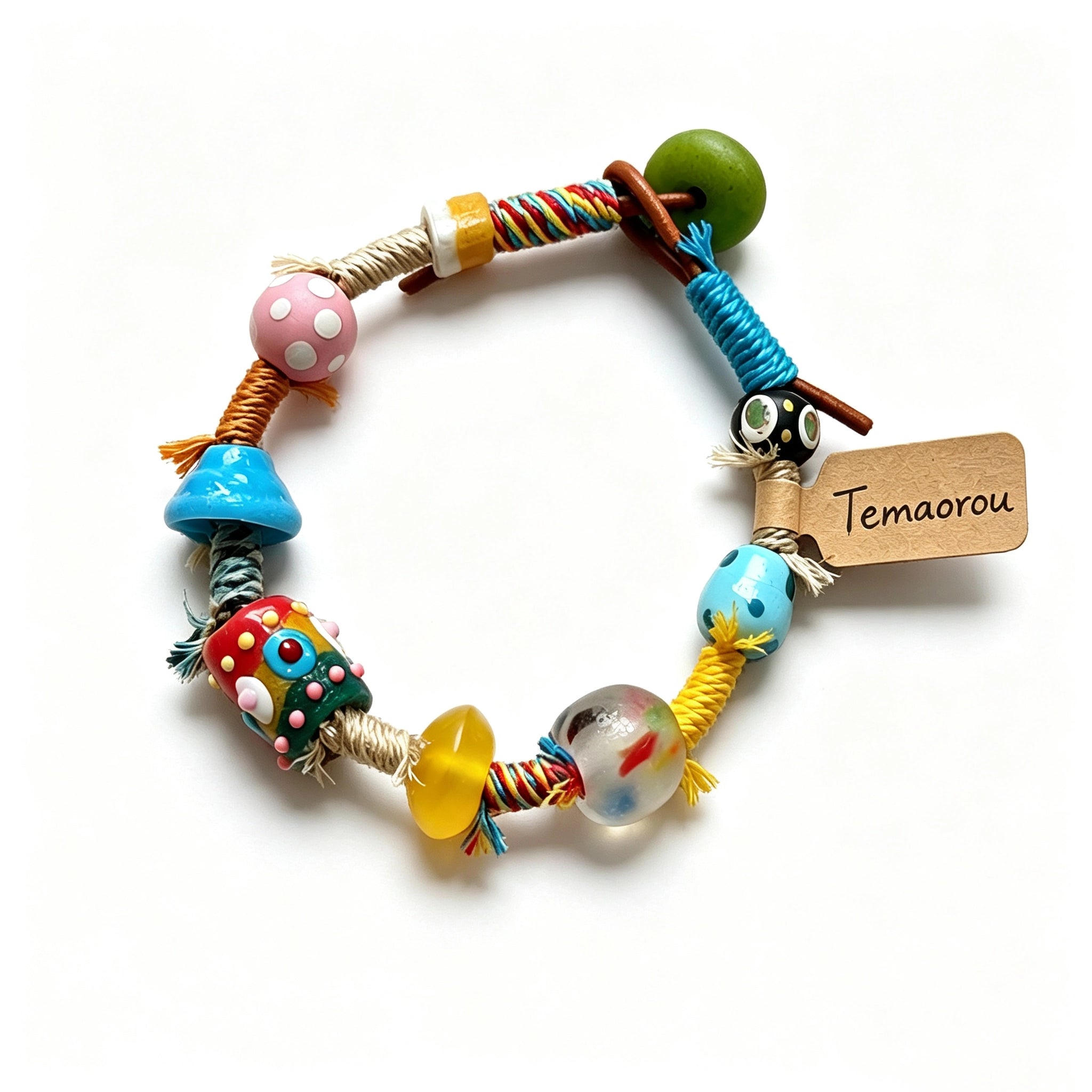 This handmade boho bracelet bursts with vibrant dopamine colors, featuring hand-painted clay beads, twisted linen threads, and quirky sculpted charms. Every bead and wrapped fiber is carefully crafted, bringing playful, retro artistic vibes to your wrist. It is a unique wearable art piece full of whimsical details.