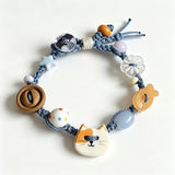 This hand-woven bracelet features lovely cartoon cat and fish charms paired with playful colorful beads. Blending retro texture and dopamine style, it is a delicate handmade accessory full of fun details. The adjustable braided cord makes it easy to wear for daily matching.