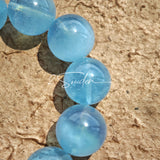 This bracelet consists of rose quartz and aquamarine. The bracelet features a bead pendant and a rhombic spacer, both of which are made of rose quartz. The bracelet is a combination of pink and blue colors.