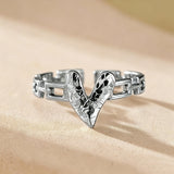 This is an adjustable open ring crafted from S925 sterling silver. It features a modern chain-link band paired with a textured heart-shaped centerpiece, boasting a "crushed ice" finish that delivers a sparkling, dimensional look. The polished silver tone lends a sleek, contemporary vibe to this versatile piece.