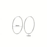 These S925 sterling silver hoop earrings feature a sleek, polished circular design with a smooth, reflective finish. They showcase a classic minimalist silhouette with a seamless, slender wire construction that exudes understated elegance. The polished surface catches light beautifully, highlighting their timeless and versatile appeal.