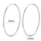 These S925 sterling silver hoop earrings feature a sleek, polished circular design with a smooth, reflective finish. They showcase a classic minimalist silhouette with a seamless, slender wire construction that exudes understated elegance. The polished surface catches light beautifully, highlighting their timeless and versatile appeal.