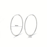 These S925 sterling silver hoop earrings feature a sleek, polished circular design with a smooth, reflective finish. They showcase a classic minimalist silhouette with a seamless, slender wire construction that exudes understated elegance. The polished surface catches light beautifully, highlighting their timeless and versatile appeal.