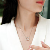 This S925 silver necklace features a delicate circular pendant encrusted with shimmering moissanite stones, forming an elegant open-circle silhouette. The slender silver chain complements the pendant perfectly, lending a refined and timeless charm to the piece. Its minimalist yet sparkling design makes it a versatile accessory for various occasions.
