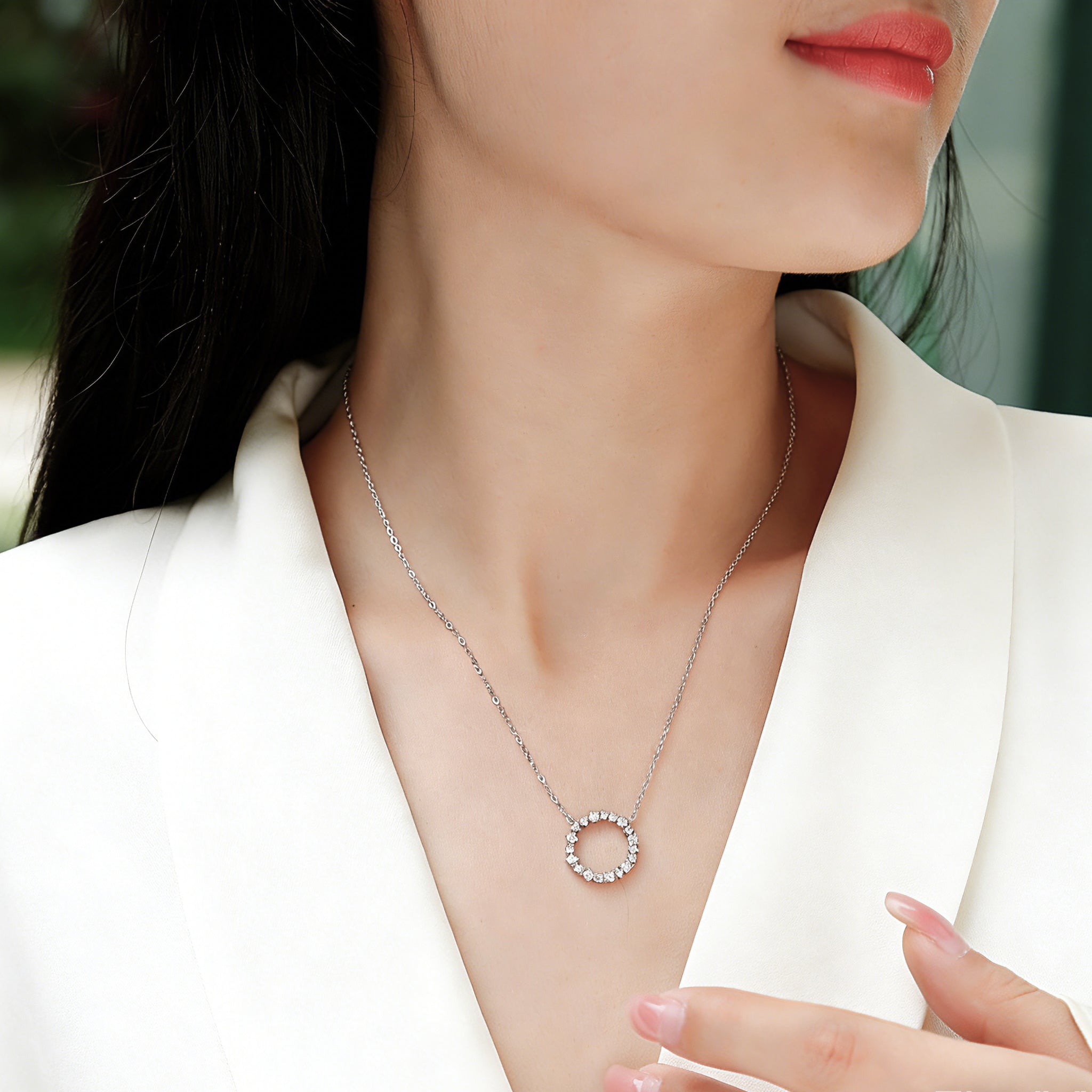 This S925 silver necklace features a delicate circular pendant encrusted with shimmering moissanite stones, forming an elegant open-circle silhouette. The slender silver chain complements the pendant perfectly, lending a refined and timeless charm to the piece. Its minimalist yet sparkling design makes it a versatile accessory for various occasions.