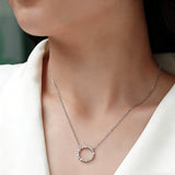 This S925 silver necklace features a delicate circular pendant encrusted with shimmering moissanite stones, forming an elegant open-circle silhouette. The slender silver chain complements the pendant perfectly, lending a refined and timeless charm to the piece. Its minimalist yet sparkling design makes it a versatile accessory for various occasions.
