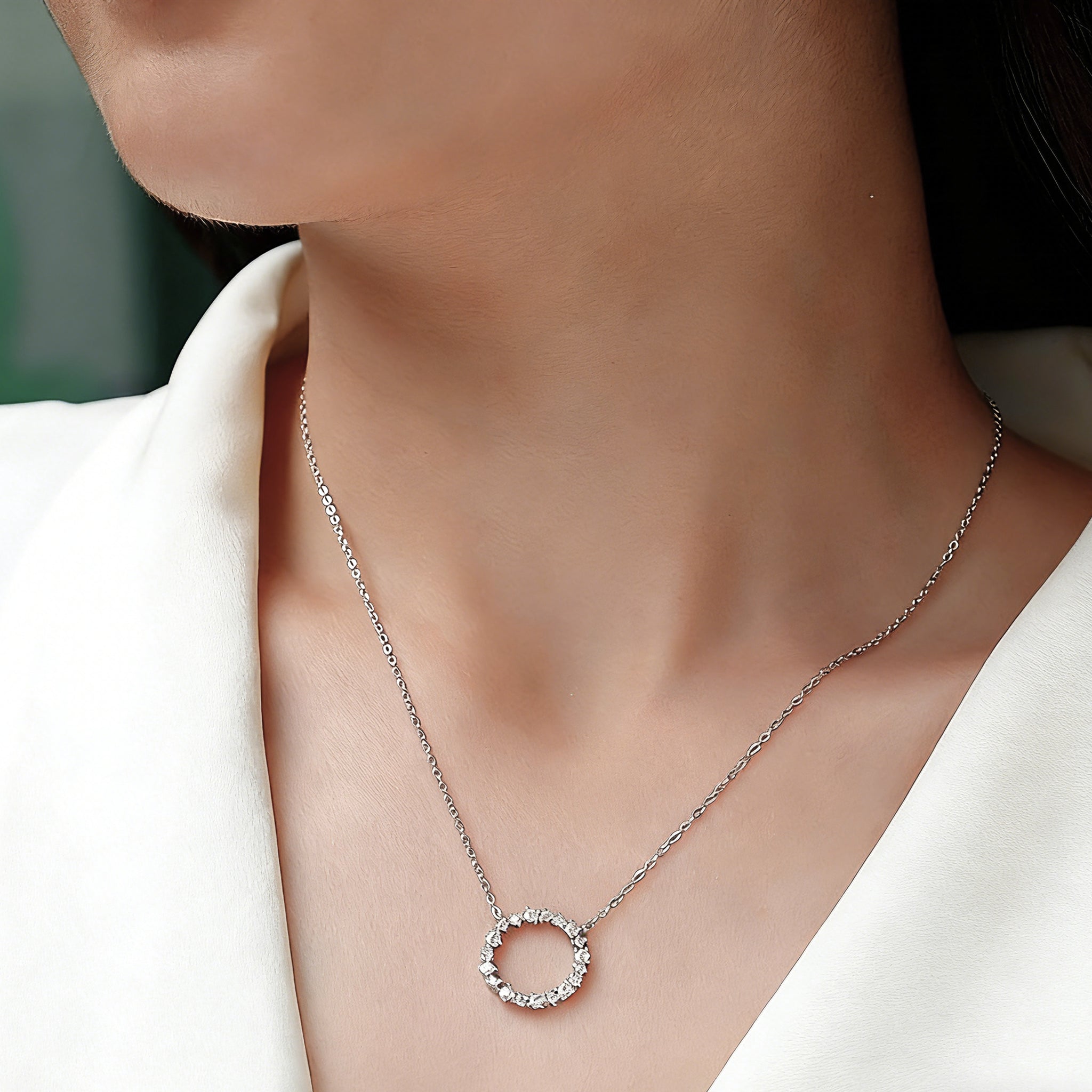 This S925 silver necklace features a delicate circular pendant encrusted with shimmering moissanite stones, forming an elegant open-circle silhouette. The slender silver chain complements the pendant perfectly, lending a refined and timeless charm to the piece. Its minimalist yet sparkling design makes it a versatile accessory for various occasions.