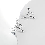 This is a pair of earrings shaped like molten lava. Inspired by the unpredictable flow of volcanic lava and liquid metal, the design breaks away from rigid geometric structures. It's with S925 silver which reflects light beautifully.