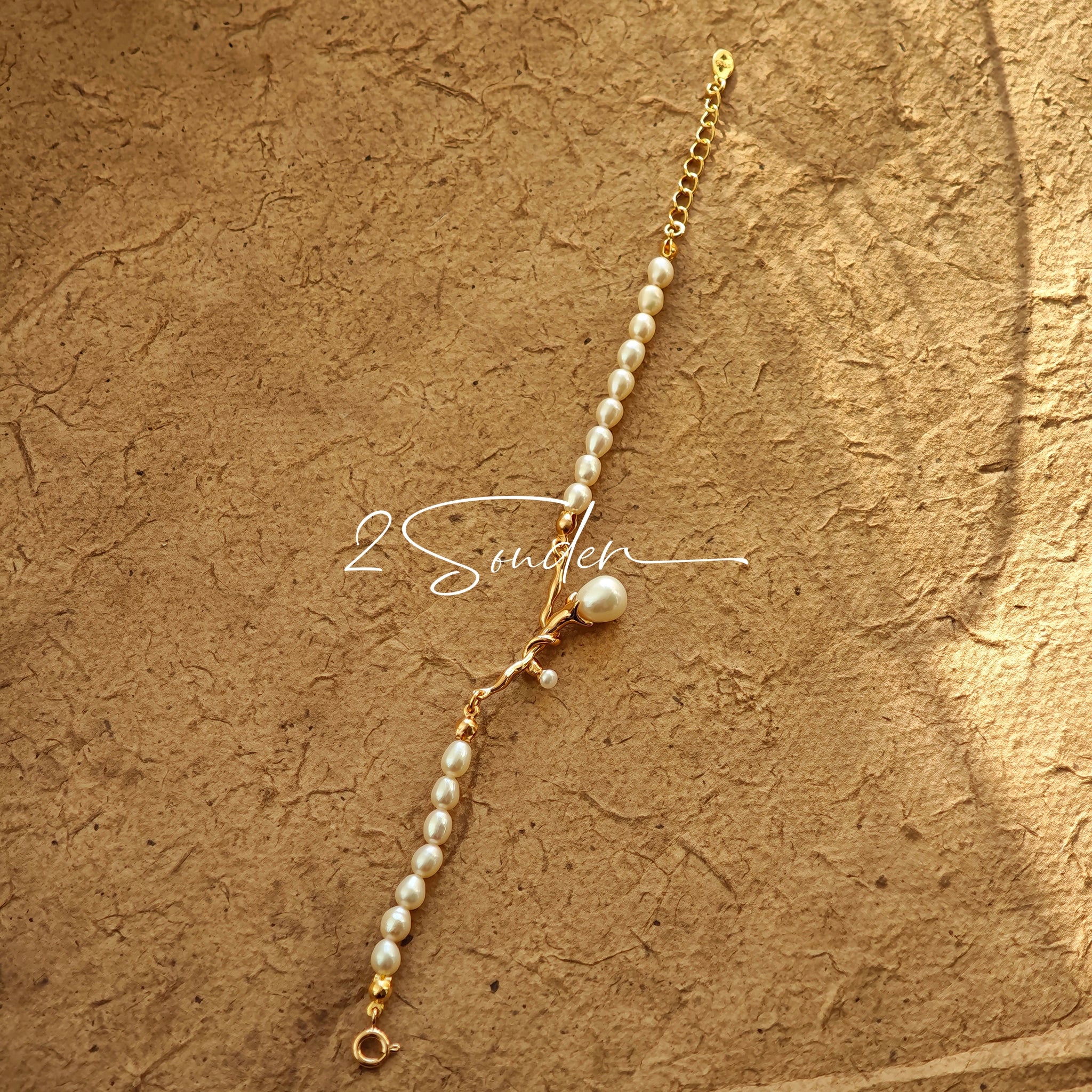 This bracelet is inspired by the romantic concept of "intertwined destiny," the vintage gold color sterling silver gently wraps together like vines. The end of the vines are plated lustrous Freshwater Pearls, symbolizing the beautiful bonds of life.
