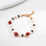 This is a bracelet made of S925 sterling silver, red cinnabars, green moss agates and natural white pearls. It's 16cm long with a 3cm extended chain. It comes with a lobster clasp which is easy to be used.
