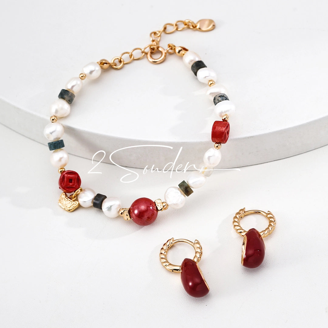 This is a bracelet made of S925 sterling silver, red cinnabars, green moss agates and natural white pearls. It's 16cm long with a 3cm extended chain. It comes with a lobster clasp which is easy to be used.