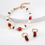 This is a bracelet made of S925 sterling silver, red cinnabars, green moss agates and natural white pearls. It's 16cm long with a 3cm extended chain. It comes with a lobster clasp which is easy to be used.