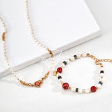This is a bracelet made of S925 sterling silver, red cinnabars, green moss agates and natural white pearls. It's 16cm long with a 3cm extended chain. It comes with a lobster clasp which is easy to be used.