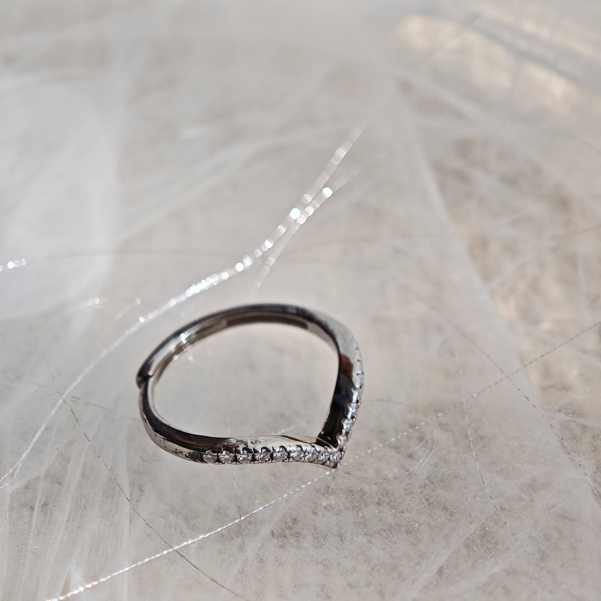 This S925 silver women's ring features an elegant crown-shaped heart design, pavé-set with sparkling moissanite stones along its curved band for a luminous, romantic appearance. Its open adjustable band allows for a comfortable, personalized fit on different finger sizes, blending delicate craftsmanship with timeless charm.