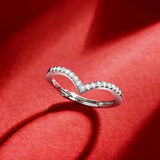 This S925 silver women's ring features an elegant crown-shaped heart design, pavé-set with sparkling moissanite stones along its curved band for a luminous, romantic appearance. Its open adjustable band allows for a comfortable, personalized fit on different finger sizes, blending delicate craftsmanship with timeless charm.