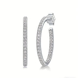 These 925 sterling silver hoop earrings are elegantly lined with sparkling moissanite stones along their entire length, creating a continuous, luminous sheen. The sleek, open-hoop design is secured with a classic butterfly back, blending timeless elegance with modern sophistication. The polished silver finish enhances the brilliance of the moissanite, making them a versatile accessory for both everyday wear and special occasions.