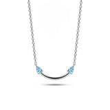 Crafted from polished S925 Sterling Silver, this necklace features a delicate 2.4cm curved bar pendant adorned with shimmering Blue Zircons to mimic a gentle, confident smile. The minimalist design is suspended on an adjustable 40cm clavicle chain, offering a mirror-like finish and a sophisticated touch of quiet luxury.