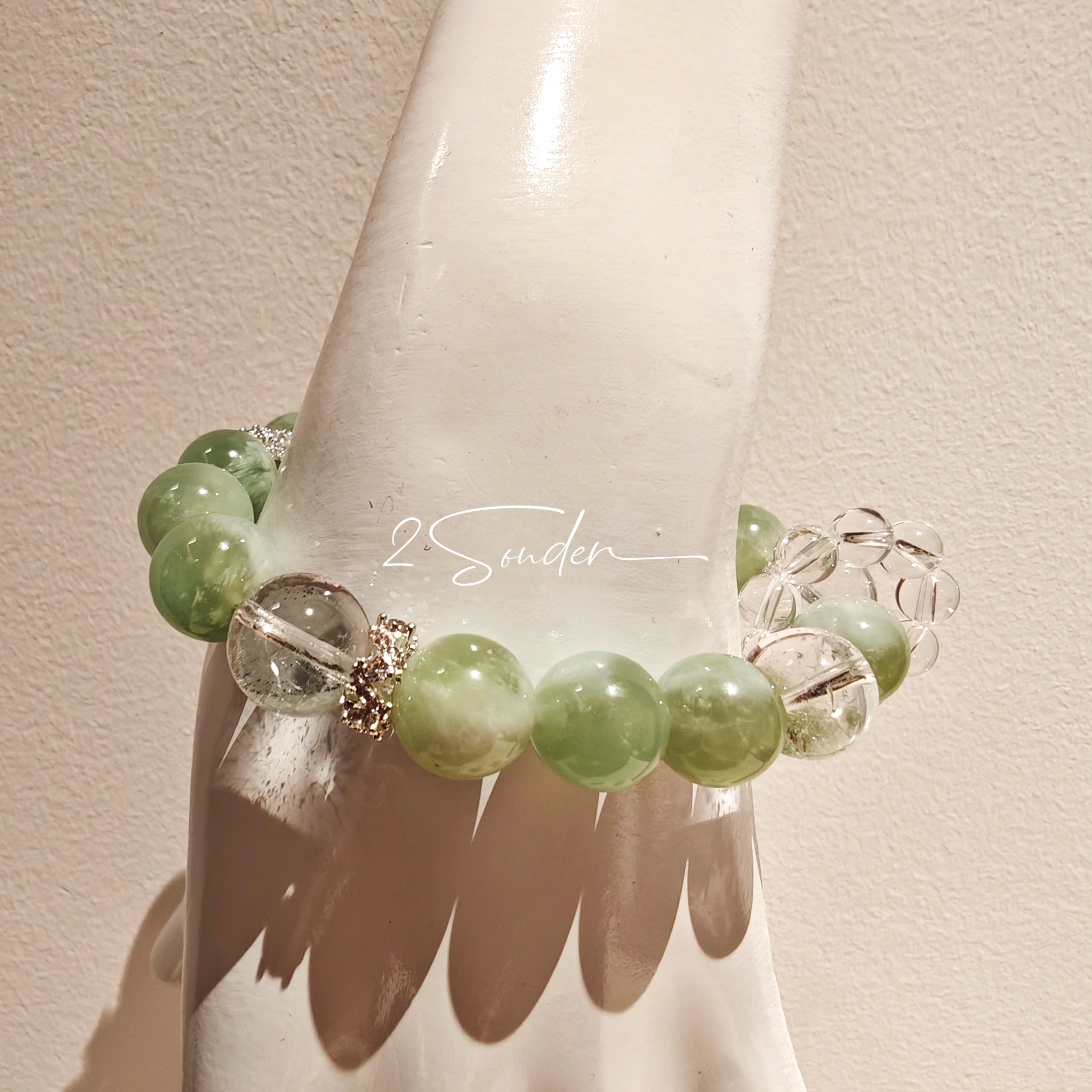 This is a bracelet consists of Xiuyan (Serpentine) Jade, Green Phantom Quartz, Clear Quartz, and 925 sterling silver accents, this gemstone bracelet blends timeless elegance with spiritual meaning.