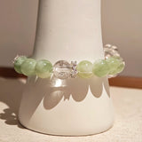 This is a bracelet consists of Xiuyan (Serpentine) Jade, Green Phantom Quartz, Clear Quartz, and 925 sterling silver accents, this gemstone bracelet blends timeless elegance with spiritual meaning.
