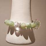 This is a bracelet consists of Xiuyan (Serpentine) Jade, Green Phantom Quartz, Clear Quartz, and 925 sterling silver accents, this gemstone bracelet blends timeless elegance with spiritual meaning.