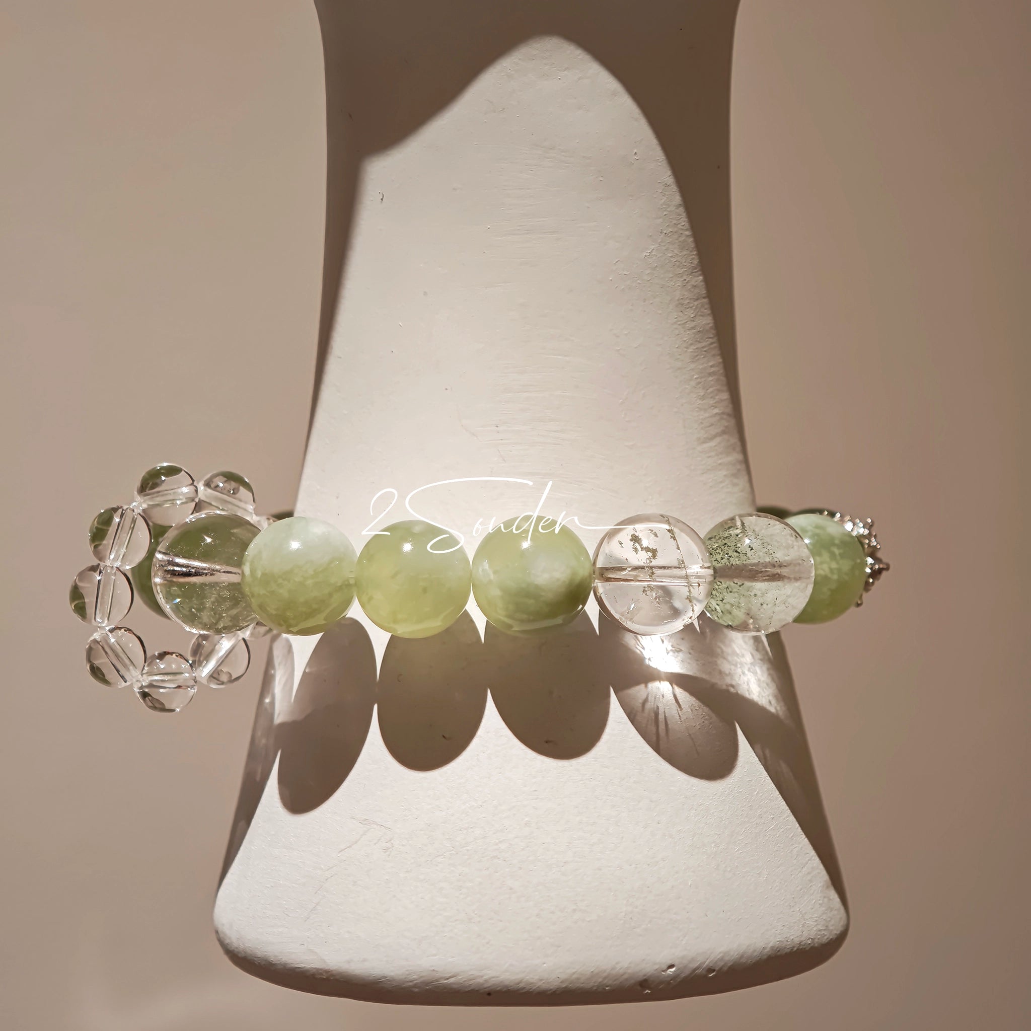 This is a bracelet consists of Xiuyan (Serpentine) Jade, Green Phantom Quartz, Clear Quartz, and 925 sterling silver accents, this gemstone bracelet blends timeless elegance with spiritual meaning.