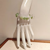 This is a bracelet consists of Xiuyan (Serpentine) Jade, Green Phantom Quartz, Clear Quartz, and 925 sterling silver accents, this gemstone bracelet blends timeless elegance with spiritual meaning.