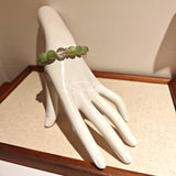 This is a bracelet consists of Xiuyan (Serpentine) Jade, Green Phantom Quartz, Clear Quartz, and 925 sterling silver accents, this gemstone bracelet blends timeless elegance with spiritual meaning.
