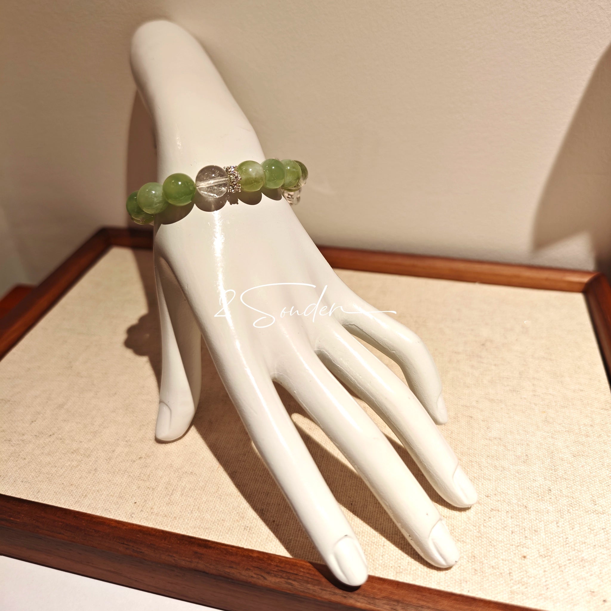 This is a bracelet consists of Xiuyan (Serpentine) Jade, Green Phantom Quartz, Clear Quartz, and 925 sterling silver accents, this gemstone bracelet blends timeless elegance with spiritual meaning.