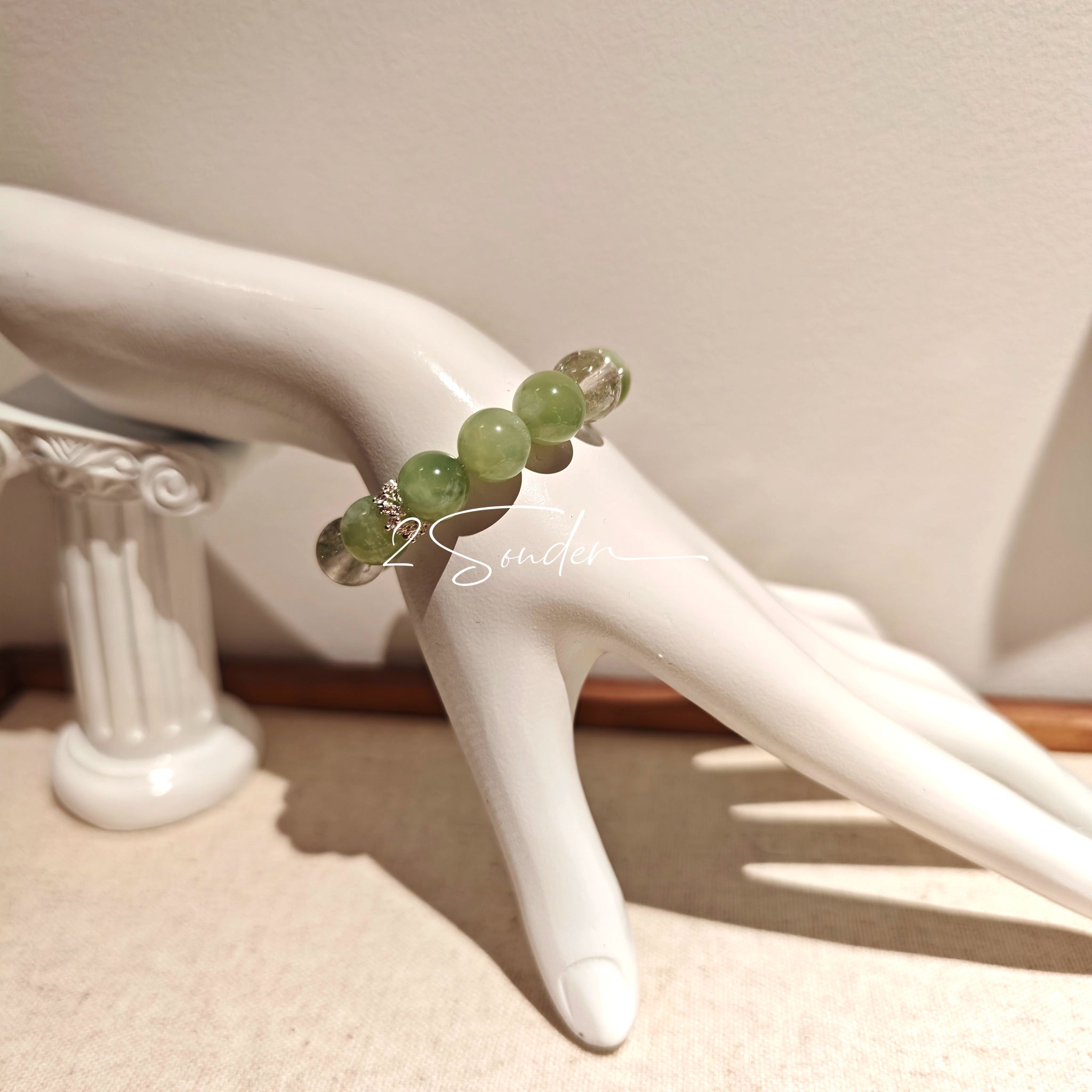 This is a bracelet consists of Xiuyan (Serpentine) Jade, Green Phantom Quartz, Clear Quartz, and 925 sterling silver accents, this gemstone bracelet blends timeless elegance with spiritual meaning.