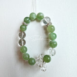 This is a bracelet consists of Xiuyan (Serpentine) Jade, Green Phantom Quartz, Clear Quartz, and 925 sterling silver accents, this gemstone bracelet blends timeless elegance with spiritual meaning.