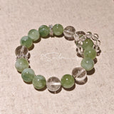 This is a bracelet consists of Xiuyan (Serpentine) Jade, Green Phantom Quartz, Clear Quartz, and 925 sterling silver accents, this gemstone bracelet blends timeless elegance with spiritual meaning.